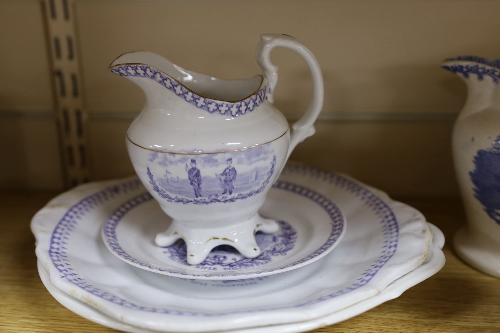 A group of mid 19th century Staffordshire British rifle volunteers and rifle target practice commemorative ceramics